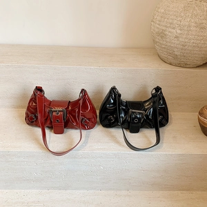 Retro glossy leather baguette bags in dark red and black with Y2K metal buckles