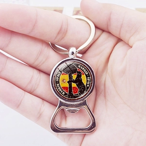 Madrid souvenir bottle opener keychain featuring Spain flag and bear sculpture