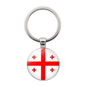 Detailed macro view of Georgia flag keychain with round glass pendant and silver ring