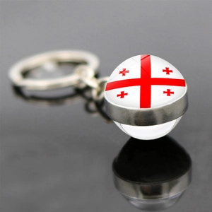 Detail of Georgia flag keychain with a glass dome pendant and silver metal ring