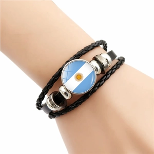 Braided leather bracelet with Argentina flag glass charm on a wrist, souvenir gift