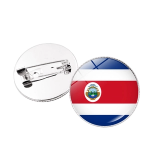 Detailed front and back view of Costa Rica flag round pin badge with safety pin fastener