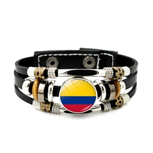 Detail of multi-layer leather bracelet with Colombia flag glass charm and metal beads