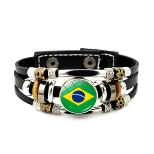 Detail of multi-layer leather bracelet with Brazil flag glass dome and vintage beads