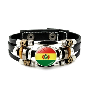 Detail of multi-layer leather bracelet with Bolivia flag glass charm and metal accents