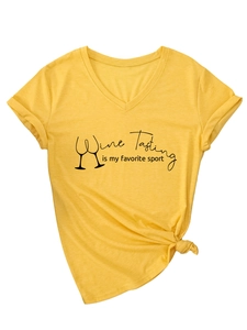 Detail of yellow V-neck tee with Wine Tasting is my favorite sport slogan and side knot