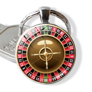 Detailed close-up of a roulette wheel glass cabochon pendant with metal keychain