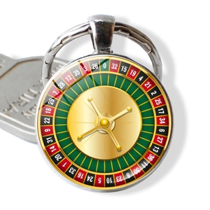 Close-up of a casino roulette wheel keychain with a detailed glass gem alloy pendant