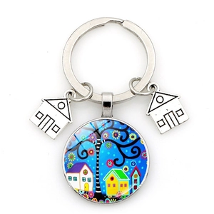 Artistic keychain featuring a starry house painting and silver metal house charms