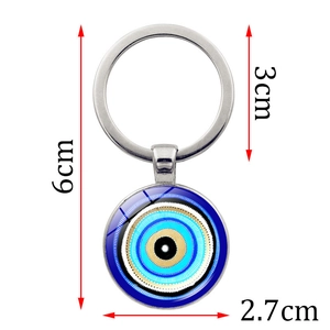Turkish Evil Eye keychain with 2.7cm blue glass pendant and metal ring on white background