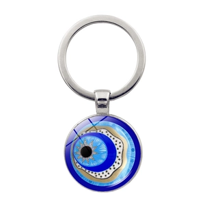 Blue Evil Eye keychain with starburst center and gold accents on a polished ring
