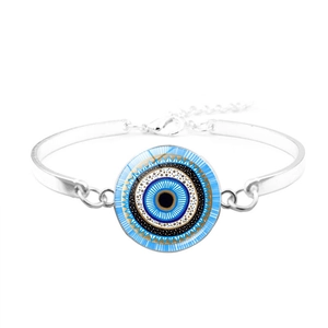 Detail of silver evil eye bracelet featuring blue enamel charm and adjustable lobster clasp