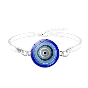 Detailed close-up of a silver-toned Evil Eye bangle with a blue glass nazar charm