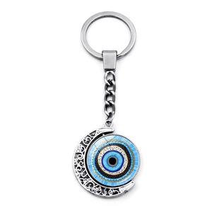 Rotating Turkish evil eye keychain with silver crescent moon hollow pattern design