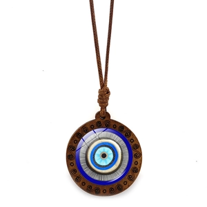 Bohemian Evil Eye necklace with wooden pendant and adjustable brown cord on white background