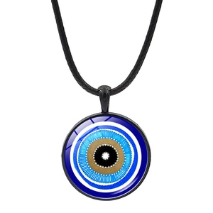 Macro shot of circular blue evil eye pendant with black cord and polished glass finish