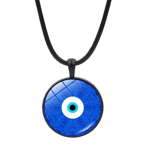 Macro detail of Turkish evil eye pendant with blue mandala pattern on black cord