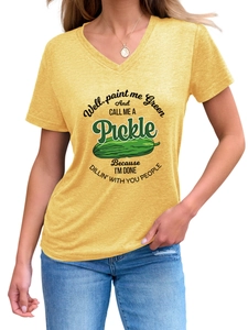 Close-up of yellow V-neck T-shirt with funny green pickle graphic and printed text