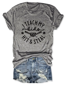Detailed flat lay of gray T-shirt with baseball graphic and ripped denim shorts