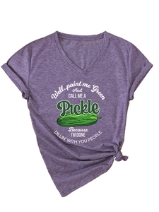 Detail of V-neck purple t-shirt showing knotted hem and green pickle graphic print