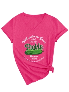 Macro detail of V-neck pink tee with funny green pickle print and stylish hem knot