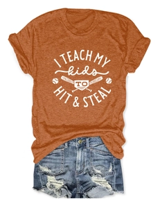 Detail view of cotton t-shirt with baseball graphic paired with denim shorts