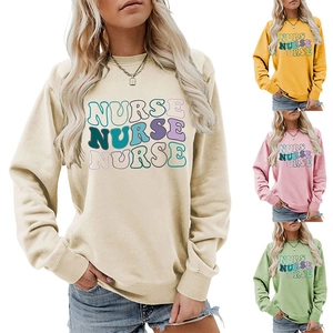 Detail view of colorful retro NURSE print on women crewneck sweatshirt in multiple colors