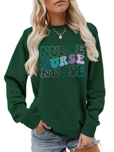 Close-up of wavy retro bubble font Nurse print on forest green crewneck sweatshirt