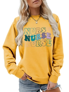 Close-up of ribbed neckline and colorful nurse printed letters on a yellow sweatshirt