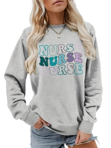 Detail of grey crewneck sweatshirt featuring colorful triple NURSE graphic print design