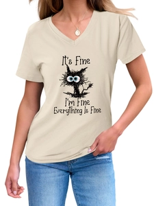 Close-up of the V-neck detail and sarcastic cartoon cat print on a beige women's T-shirt