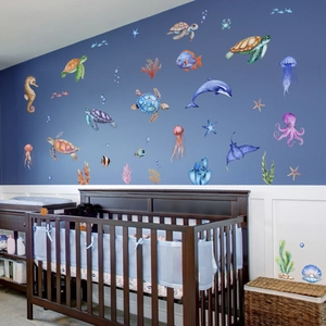 Nautical nursery wall decals with watercolor dolphins, sea turtles, and colorful coral reefs
