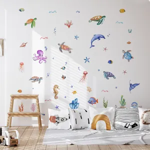 Nursery room scene with watercolor ocean animals wall decals featuring sea turtles and coral