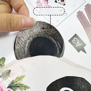 Detail of translucent panda and pink floral wall sticker showing adhesive backing material