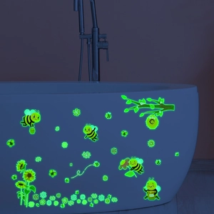 Luminous green honeybee and sunflower wall stickers glowing on a white bathtub