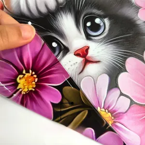 Close-up of double-sided kitten and floral window sticker with glossy waterproof finish