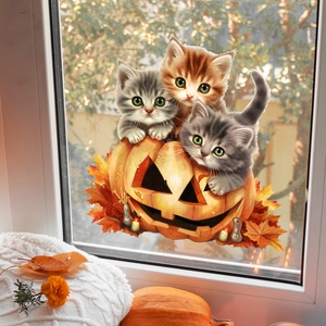 Detail of cute kittens with pumpkin and maple leaves window stickers for autumn decor