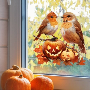 Detailed view of autumn window clings featuring birds, pumpkins, and maple leaves on glass