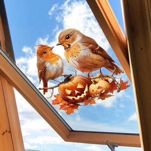Detail of autumn window stickers featuring pumpkins, birds and maple leaves on glass