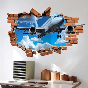 3D wall sticker featuring a white plane breaking through a brick wall into the blue sky