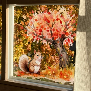 Fall static window decals with squirrel and maple tree on glass in cozy autumn setting