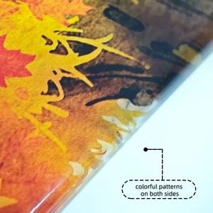 Detail of fall maple leaf and pumpkin window cling with double-sided colorful patterns