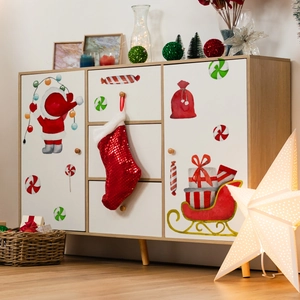 Christmas wall stickers with Santa and reindeer on a white cabinet for holiday home decor