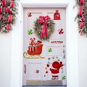 Christmas wall stickers with Santa and sleigh decorating a white door for holiday home decor