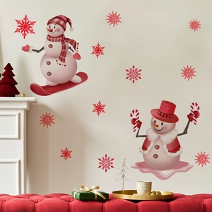 Close-up of cute Christmas snowman and red snowflake wall stickers for home decor