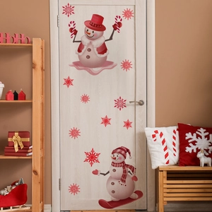 Detail of Christmas snowman wall decals on a white door with festive room decor
