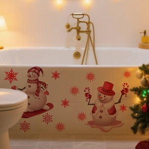 Detail of creative Christmas snowman wall stickers applied on a bathtub for festive decor