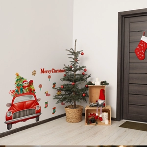 Detail of festive Christmas wall decals with retro car and Merry Christmas lettering