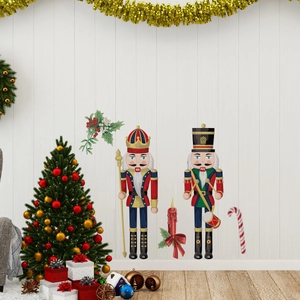 Detailed view of Nutcracker wall decals with a candle and candy cane on wood