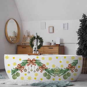 Detail of waterproof Christmas stickers with pine branches and bows on a white bathtub